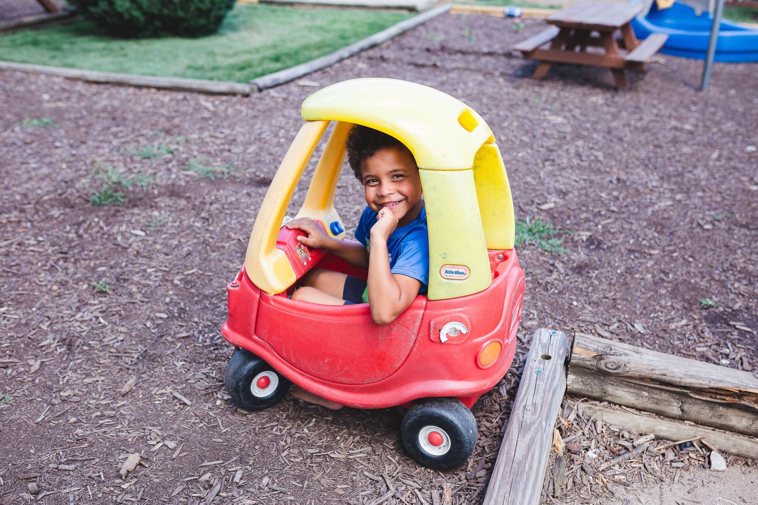 Kid playing in toy car